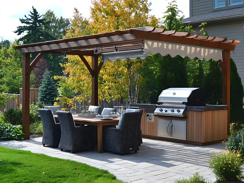 A beautiful backyard patio featuring a wooden pergola, outdoor dining set, and built-in grill. Perfect for summer entertaining.