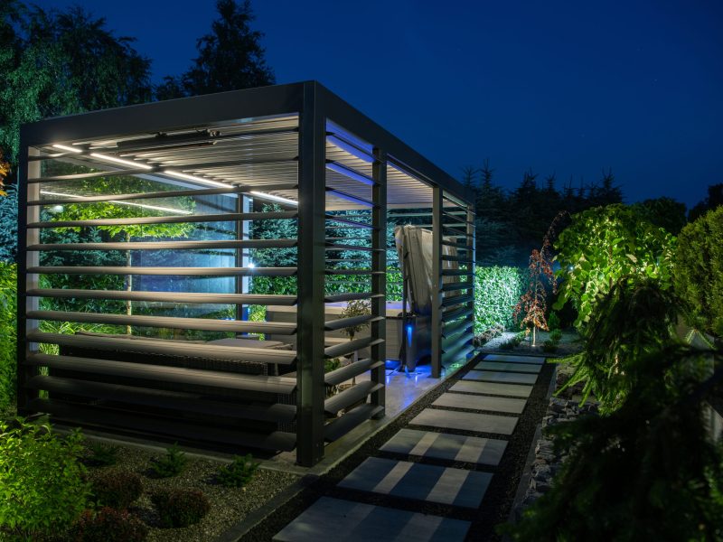 Modern Backyard SPA Shelter Bower with LED Illumination and Active Wall Blinds. Open Hot Tub Blue Illuminated. Garden Architecture Theme.